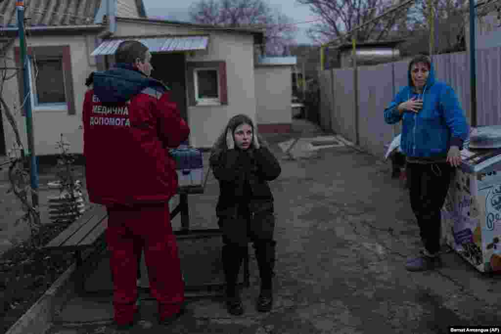 A paramedic arrives at the scene.