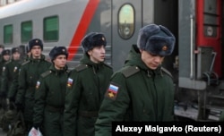 Russian conscripts called up for military service depart for garrisons at a railway station in Omsk, Russia, in November 2022.