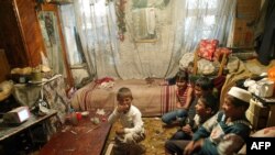 Back to normal in Andijon? A file photo shows a family watching television in the eastern Uzbek city.