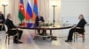 Russian President Vladimir Putin (center) holds talks with Azerbaijani President Ilham Aliyev (left) and Armenian Prime Minister Nikol Pashinian in Sochi on October 31.