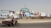 An Afghan man drives past parliamentary election campaign billboards for various political parties in Helmand in 2018, three years before the Talban takeover of the country. 