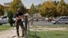 A Taliban fighter stands guard after a blast in front of the Russian Embassy in Kabul in September.