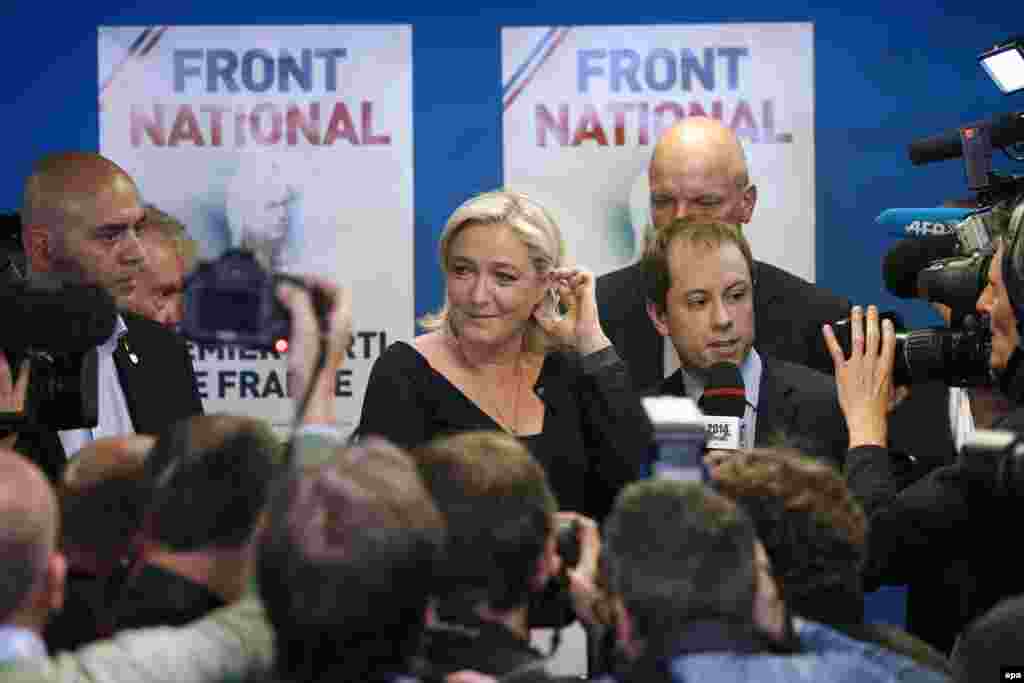 Marine Le Pen (center), the president of France&#39;s far-right National Front party, speaks after her party won 26 percent of the country&#39;s vote for members of the European Parliament, ahead of the governing Socialists and the center-right Union for a Popular Movement.