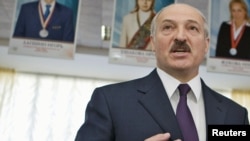 Belarus President Alyaksandr Lukashenka speaks to media at a polling station during local elections in Minsk in April.