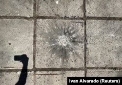 A wall bears the mark of cluster shelling in a residential area of Kharkiv on May 23.