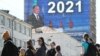 An electronic screen, installed on the facade of a building in Yekaterinburg, shows Russian President Vladimir Putin as he delivers his annual address on April 21. 