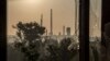 The Azot chemical plant is seen through a broken window in the city of Syevyerodonetsk on June 19.