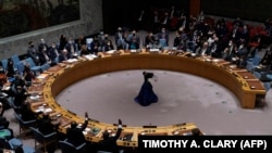 Russia's representative to the United Nations, Vasily Nebenzya, keeps his hand down during a vote on a draft resolution that would condemn Russia for invading Ukraine, February 25, 2022