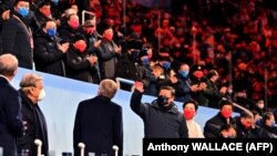 Chinese leader Xi Jinping (center) greets the crowd during the opening ceremony of the Beijing Winter Olympics on February 4. 