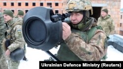 A Ukrainian serviceman points an anti-tank weapon, supplied by Britain, amid tensions between Russia and the West over Ukraine, during drills in the Lviv region in a photo released on January 27.