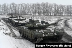 Russian T-72B3 main battle tanks take part in drills held by the armed forces of the Southern Military District at the Kadamovsky range in the Rostov region on January 27.