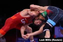 Thomas Gilman of the United States (left) competes against Reza Atrinagharchi of Iran at the Tokyo Olympics in August 2021.