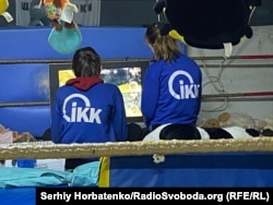 Children play video games at a volunteer-run community center.