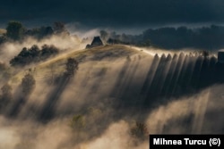 A village farm caught in morning light in the Apuseni Mountains in 2021.