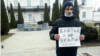 Mikhail Nesvat participating in a single-person picket. His sign reads: "Brothers, Not Enemies #notowar." (file photo)