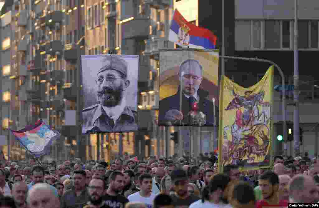 During the August 28 march, pictures of Putin and Dragoljub &quot;Draza&quot; Mihailovica, a controversial Serb nationalist leader during World War II, were carried aloft. In 2013, Russia introduced a law banning &quot;propaganda of nontraditional sexual relations&quot; among minors, punishable with fines and imprisonment.