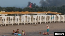 Smoke rises from Saky air base following the attack on August 9.