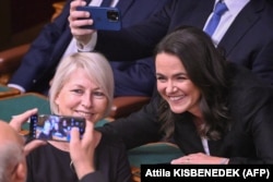 Katalin Novak (right) poses for a selfie with parliament deputyKatalin Csobor in parliament in Budapest on March 10, prior to a secret vote on the presidential position.