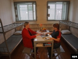 Two women reading in their prison cell in an "investigative isolation ward" in Mozhaysk, near Moscow.