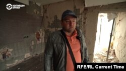 Kostyantyn Lishchuk and his neighbors are trying to rebuild after a direct hit to their residential tower in Kyiv.