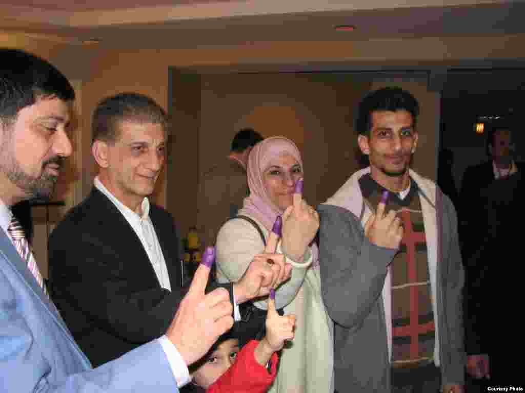 Iraqi expat voters show their ink-stained fingers after casting their ballots in Virginia. (Photo: Radio Free Iraq)