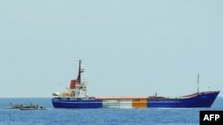 An Israeli handout photo of Israeli forces nearing the orange, red, and green-marked "Rachel Corrie" on June 5, when it was seized while bound with supplies for Gaza.