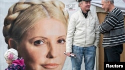 Supporters of jailed former Prime Minister Yulia Tymoshenko chat in a protest tent camp in central Kyiv on October 7.