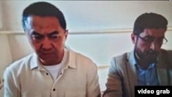 Qairat Satybaldy (left) was sentenced to six years in prison in September on fraud and embezzlement charges.