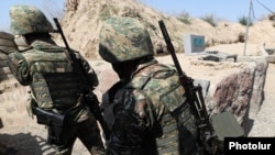 Armenian soldiers take up positions on the border with Azerbaijan (file photo)