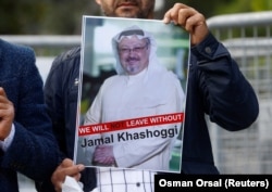 A demonstrator holds a picture of Saudi journalist Jamal Khashoggi during a protest in front of the consulate in Istanbul last month.