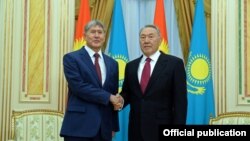 Atambaev (left) and Nazarbaev during cozier times in 2014.