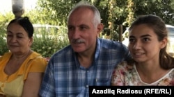 A happy Mehman Aliyev, with his wife Zemfira Aliyeva (left) and their daughter, Leyla, after his release from prison on September 11.