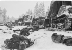 Dead Soviet soldiers lie in the aftermath of a devastating attack on a Soviet column on the Raate Road in January 1940.