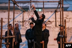 Officials prepare a noose ahead of a public hanging In Iran. Freedom House said their was a significant spike in the number of executions carried out in the Persian Gulf country in 2015. (file photo)