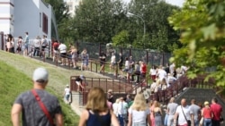 People line up to vote at a school in Minsk on August 9.