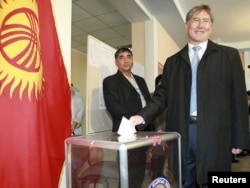 Until recently the prime minister, presidential candidate Almazbek Atambaev casts his ballot during the presidential election at a polling station in Bishkek on October 30.