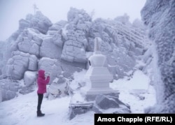 Yulia Gasheva bows after making several circles of a stupa as part of her daily ritual.