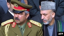 Afghan President Hamid Karzai (right) and General Abdul Rashid Dostum in March 2002.