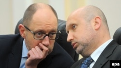 Former Prime Minister Arseniy Yatsenyuk (left) and National Security and Defense Council chief Oleksandr Turchynov are both on the list.