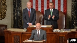 Afghan President Ashraf Ghani (center) is applauded by House Speaker John Boehner (right) and Vice President Joe Biden (left) as he addresses a joint session of Congress at the U.S. Capitol in Washington in March 2015.