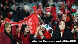 Women soccer fans attend a match in Tehran on November 10, 2018. 