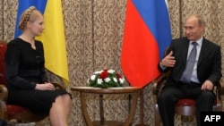 Russian Prime Minister Vladimir Putin meets with Ukrainian Prime Minister Yulia Tymoshchenko in Astana on May 22.