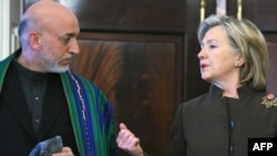 U.S. Secretary of State Hillary Clinton and Afghan President Hamid Karzai at the U.S. State Department on May 11