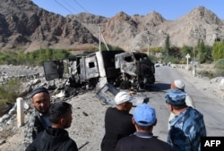 A burnt-out truck sits on a road near the Kyrgyz-Tajik border in the village of Ak-Say, some 1,000 kilometers from Bishkek, on September 20.