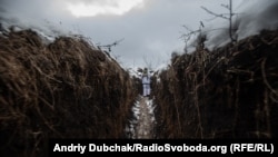 A Ukrainian soldier holds a position near the town of Zolote in the Luhansk region earlier this month. 