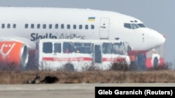 A bus transports Ukrainians and other nationals who were evacuated from China upon their arrival in Kharkiv on February 20.