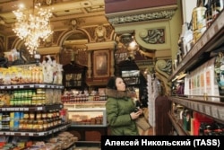 A woman browses well-stocked shelves in 2006.