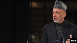 Afghan President Hamid Karzai delivers a speech at the Munich Security Conference.