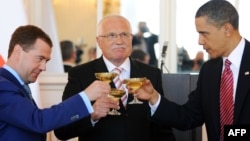 U.S. President Barack Obama (right) toasts with Czech counterpart Vaclav Klaus and Russian President Dmitry Medvedev (right) after signing the New START accord in Prague in 2010. 