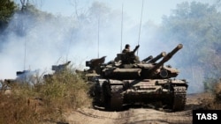 Pro-Russian separatists withdraw tanks from the front line in the Luhansk region in October -- have they since returned, as some reports suggest?